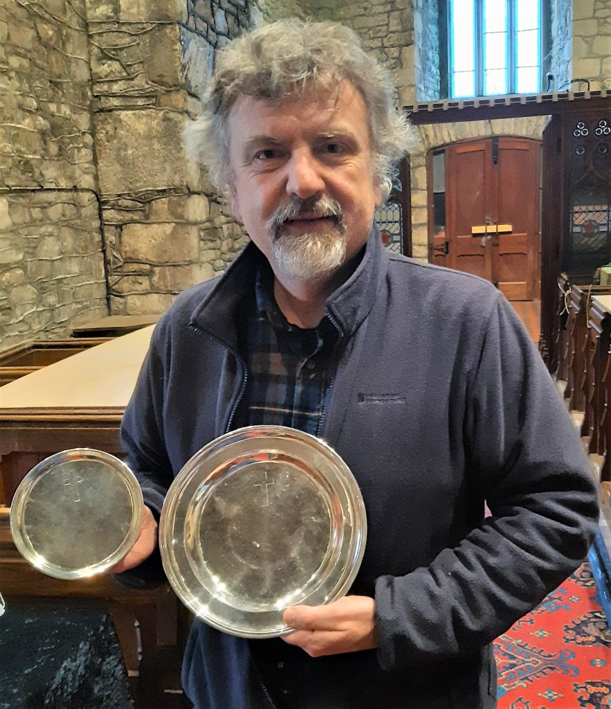 Professor Simon Haslett with the silver paten alms dish presented to Llandysul Church on Whit Sunday 1860 by Charles Williams, Principal of Jesus College and Rector of Llandysul.