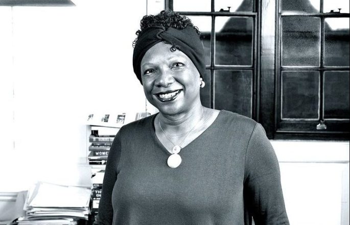 Patricia Daley standing behind her desk