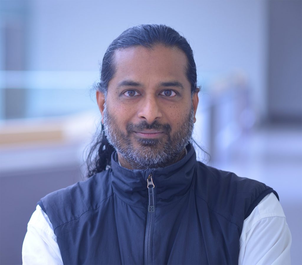 Professor standing in lab space